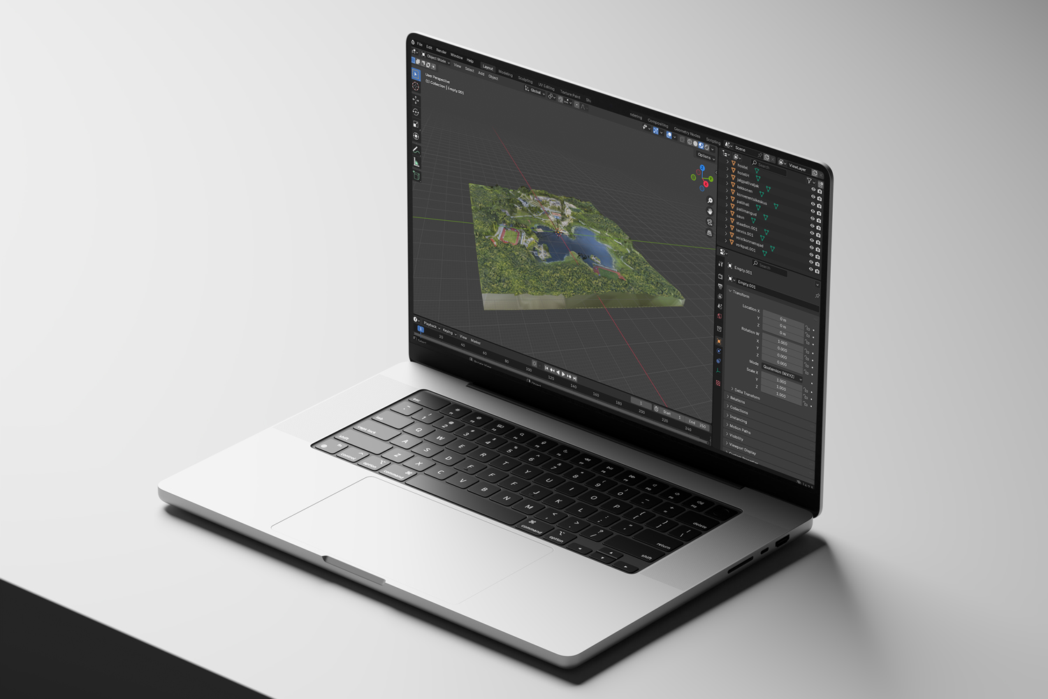 A laptop displaying a detailed 3D model in blender on its screen, showcasing behind the scenes for the website.