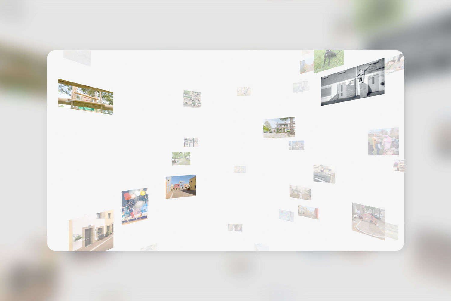 A white wall featuring an eclectic arrangement of various framed photographs and artwork in Woensel 3D Gallery.