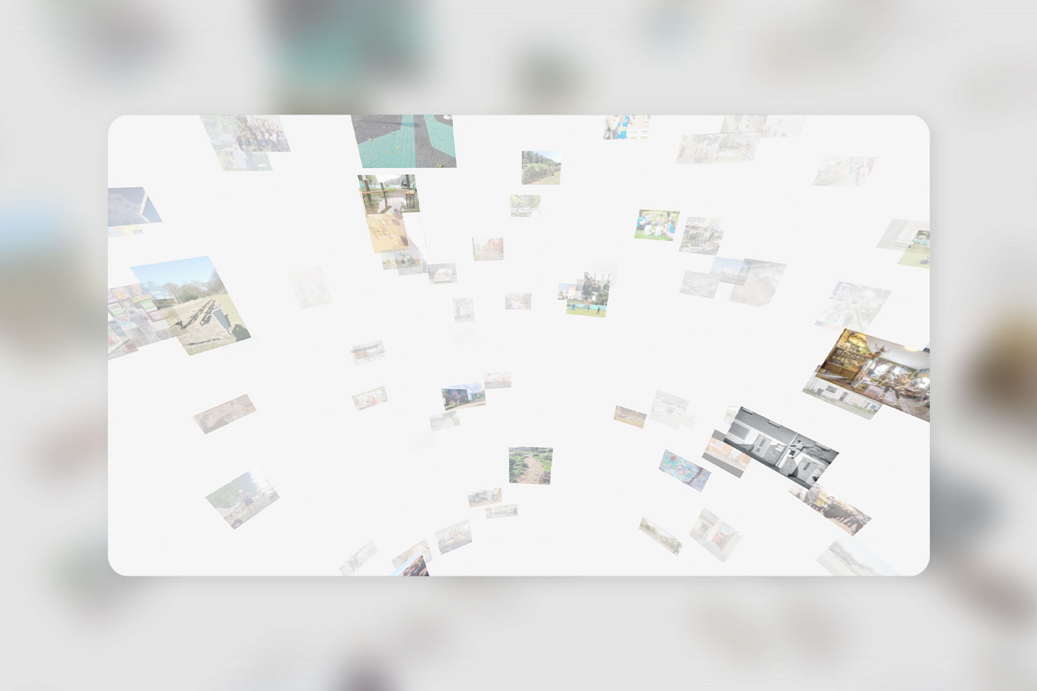 A white wall featuring an eclectic arrangement of various framed photographs and artwork in Woensel 3D Gallery.